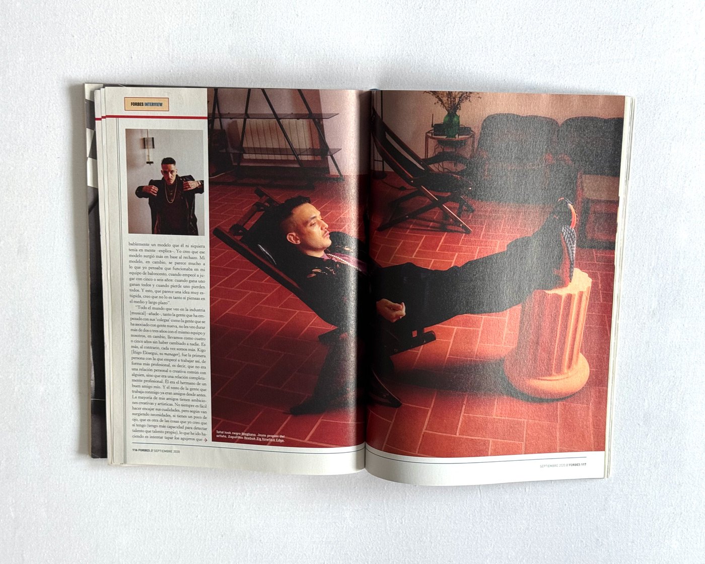 C. Tangana editorial portrait sitting on red floor